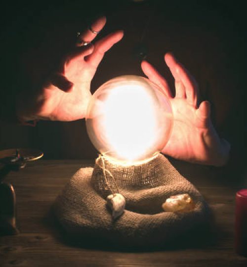 Crystal ball and fortune teller hands. Divination concept. The spiritual seance. Future reading.